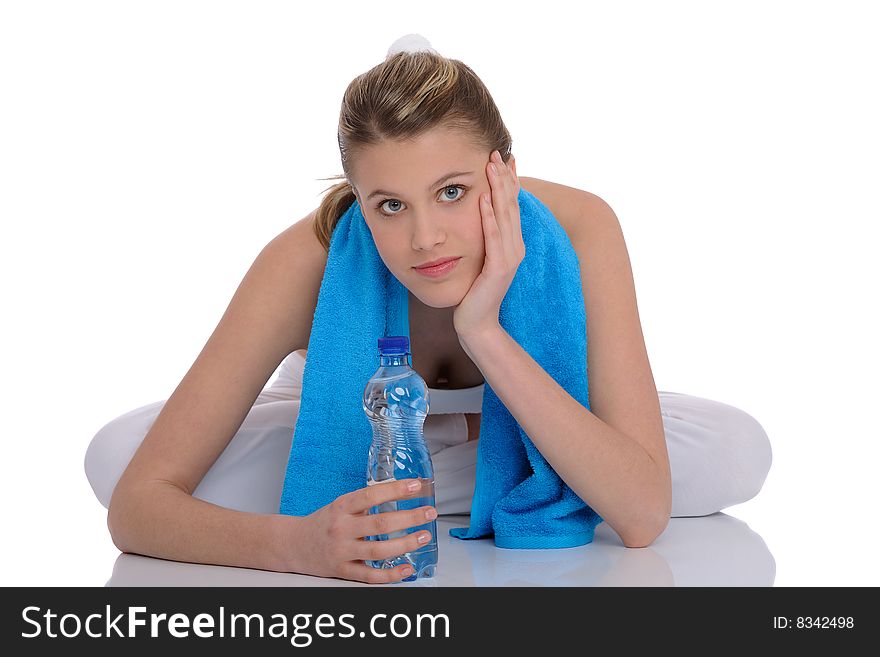 Young woman with blue fitness towel on white background