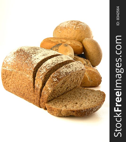 Healthy whole wheat bread and buns. Isolated on white background. Good for a healthy lifestyle!. Healthy whole wheat bread and buns. Isolated on white background. Good for a healthy lifestyle!