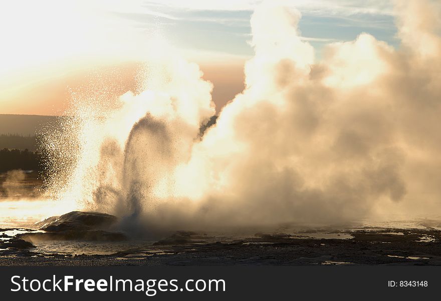 Hot geyser at sunset, Yellowstone National Park