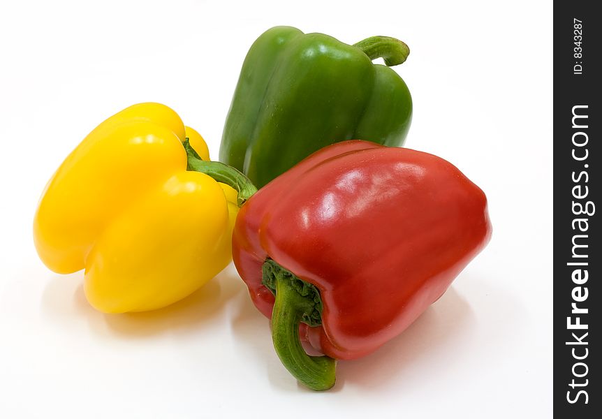 Isolated red, green and yellow paprika