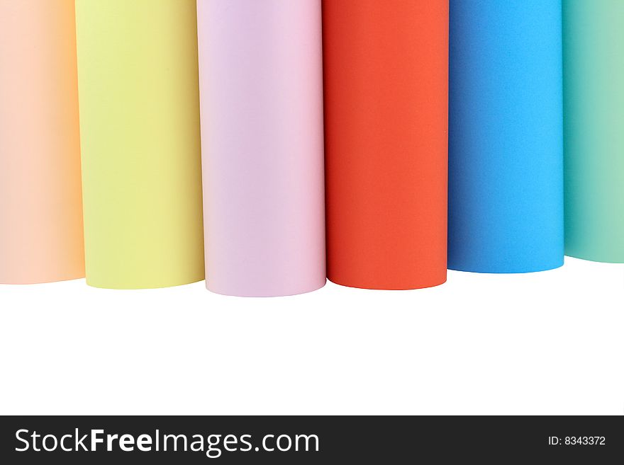 Various columns of color paper standing on white background