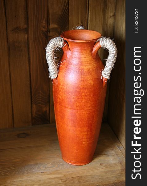 Ceramic vase on the wooden chest. Ceramic vase on the wooden chest