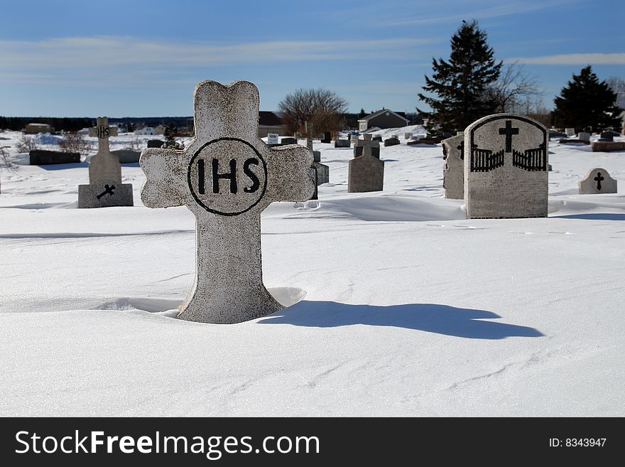 Cemetery in the snow with sunny day