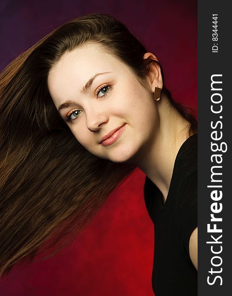 Studio portrait of an attractive woman with beautiful long hair. Studio portrait of an attractive woman with beautiful long hair