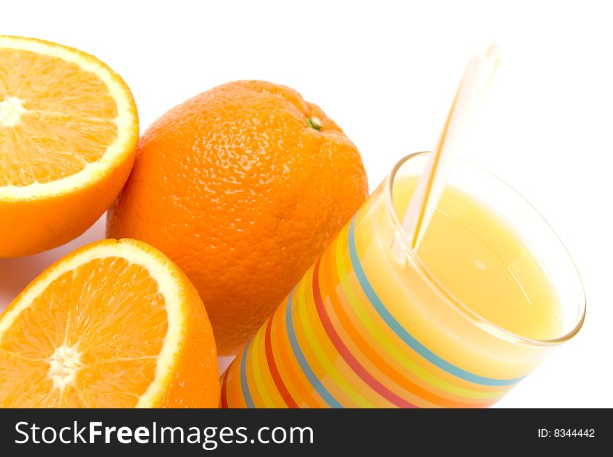 Glass Of Juice And Oranges