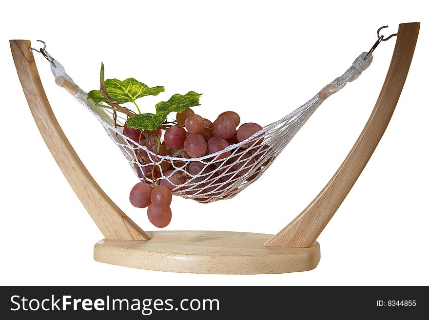 Ripe Red grapes with leaves, in a vase in hammock form