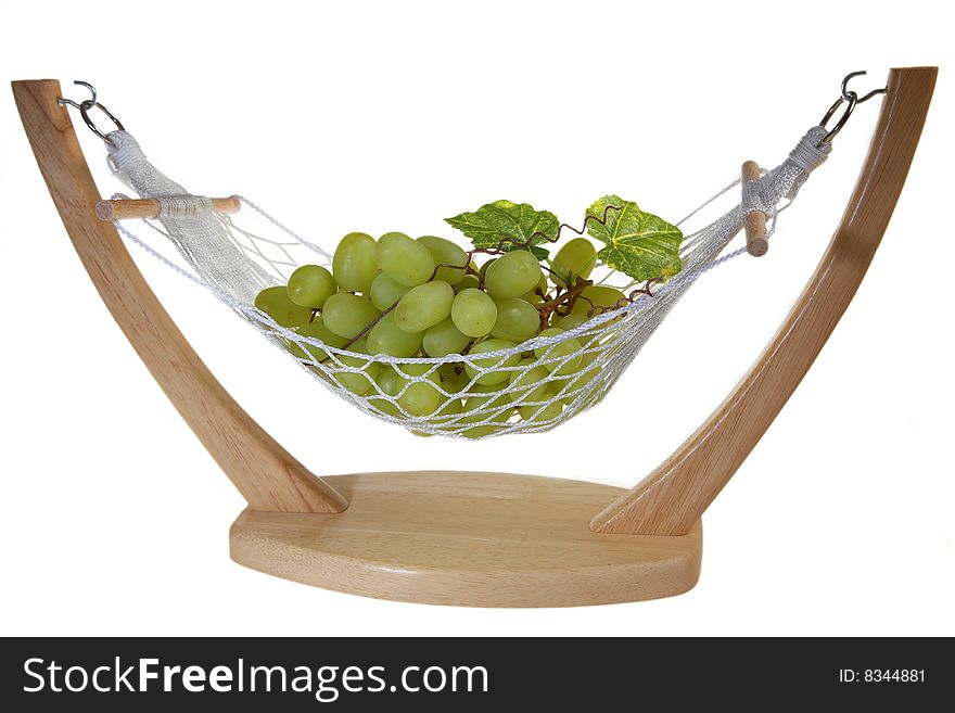 Ripe Green grapes with leaves, in a vase in hammock form