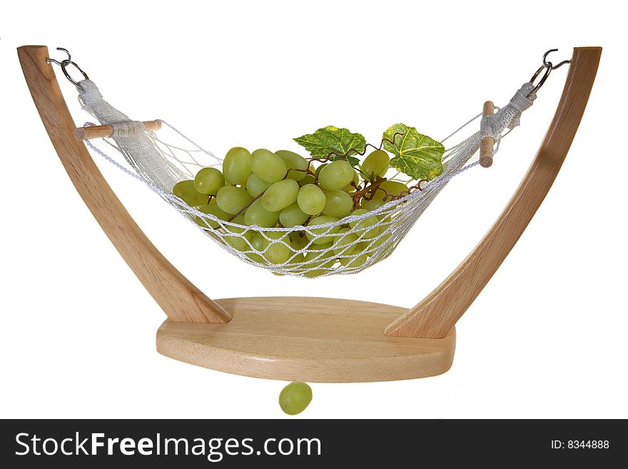 Ripe Green grapes with leaves, in a vase in hammock form