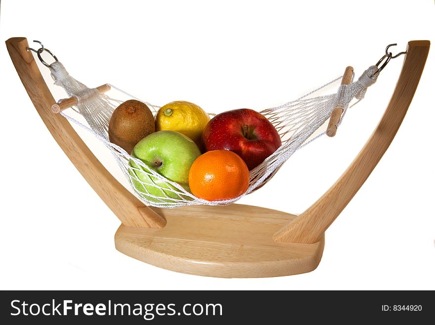 Fruits in hammock: kiwi, apples, lemon an mandarin