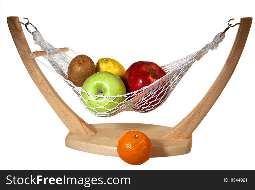 Fruits in hammock: kiwi, apples, lemon an mandarin