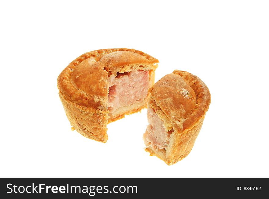 Cut pork pie isolated on white