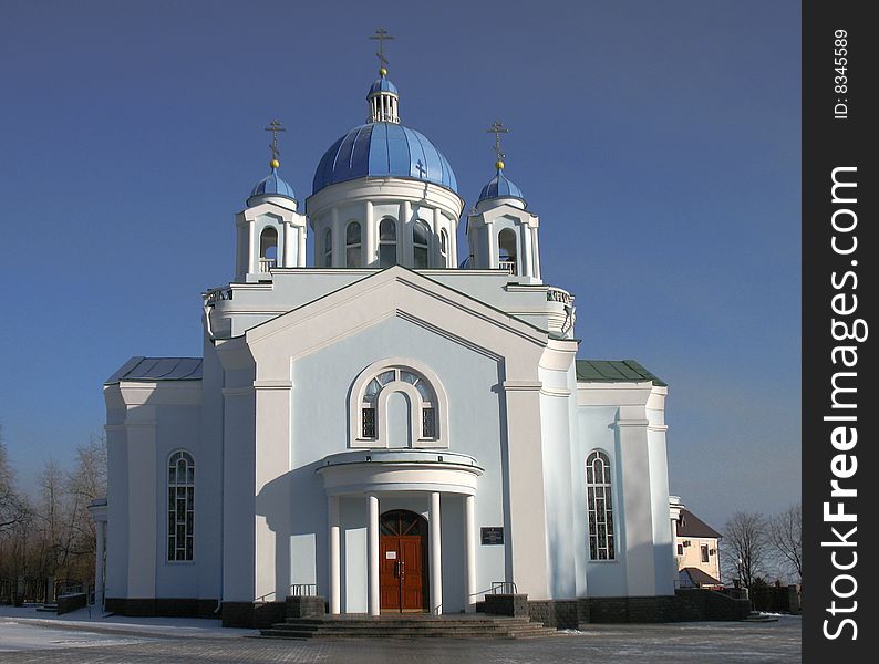 Light blue orthodox church and blue sky