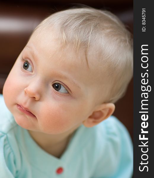 Serious adorable baby close-up - shallow DOF