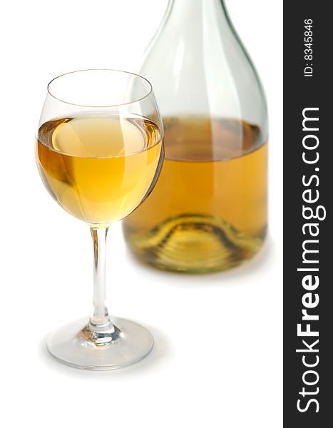 Glass and bottle of excellent white wine on a white background