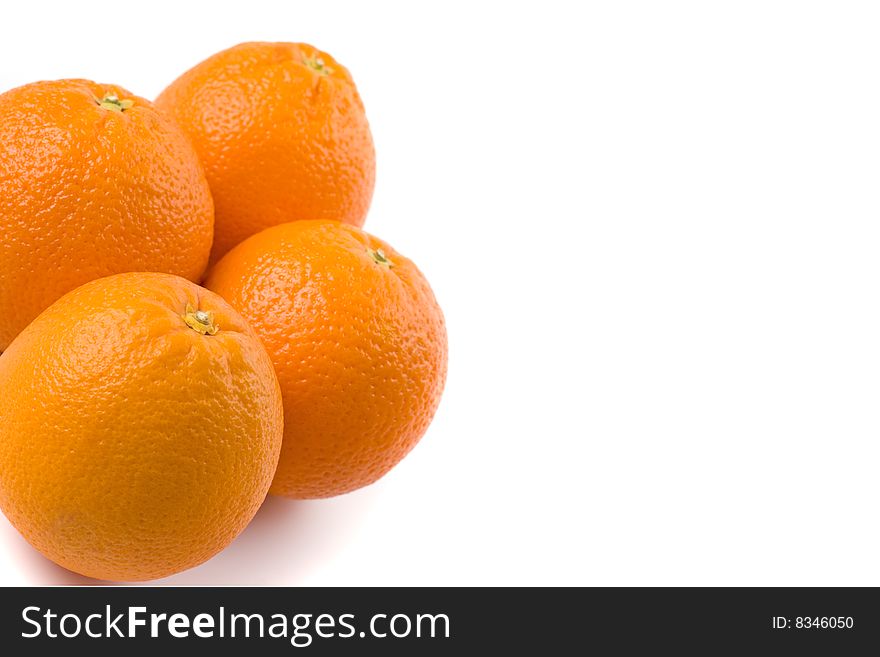 Fresh oranges closeup on white background