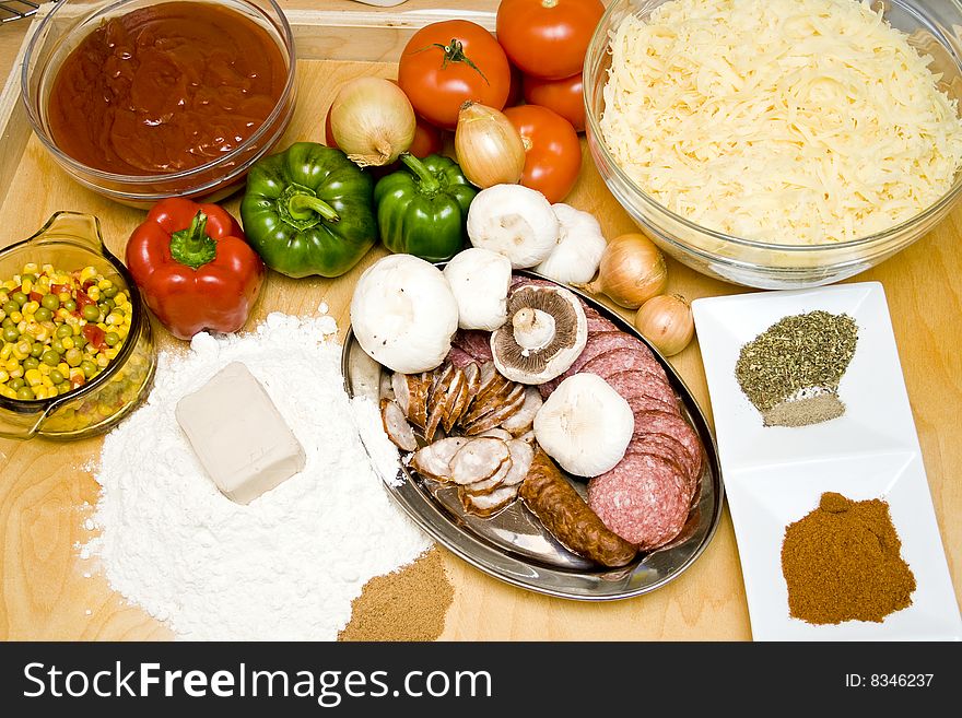 Top view at wood table full of pizza ingredients. Top view at wood table full of pizza ingredients