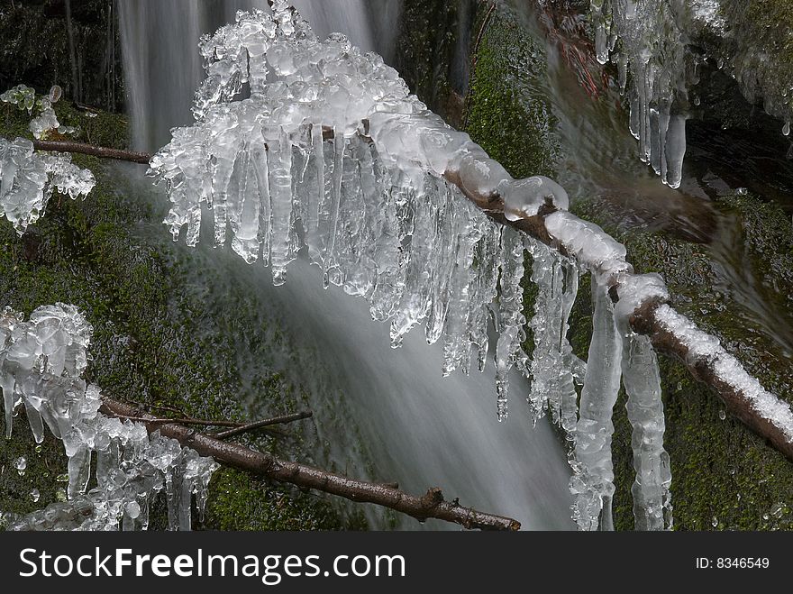 Frozen creek and icicles