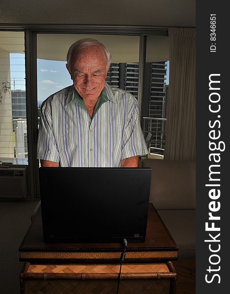 A mature computer user is typing on the keyboard. A mature computer user is typing on the keyboard