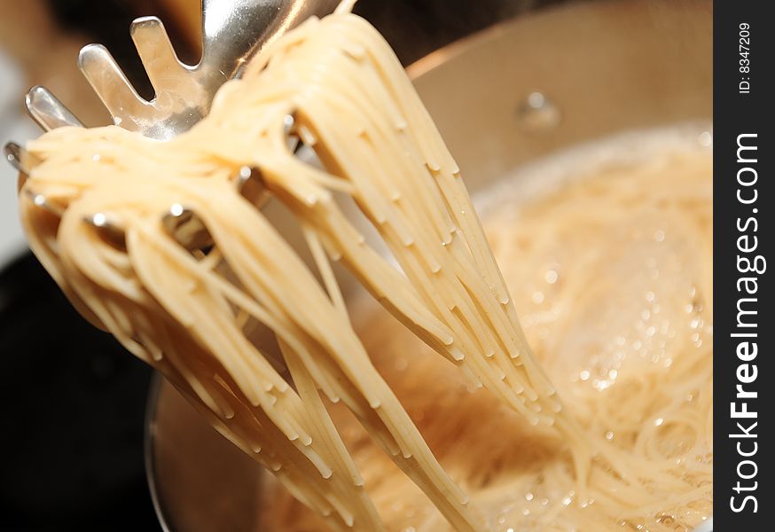 Close up spaghetti while cooking. Close up spaghetti while cooking