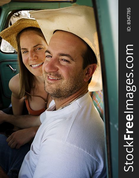 Portrait of Cowboy and woman in pickup truck cab