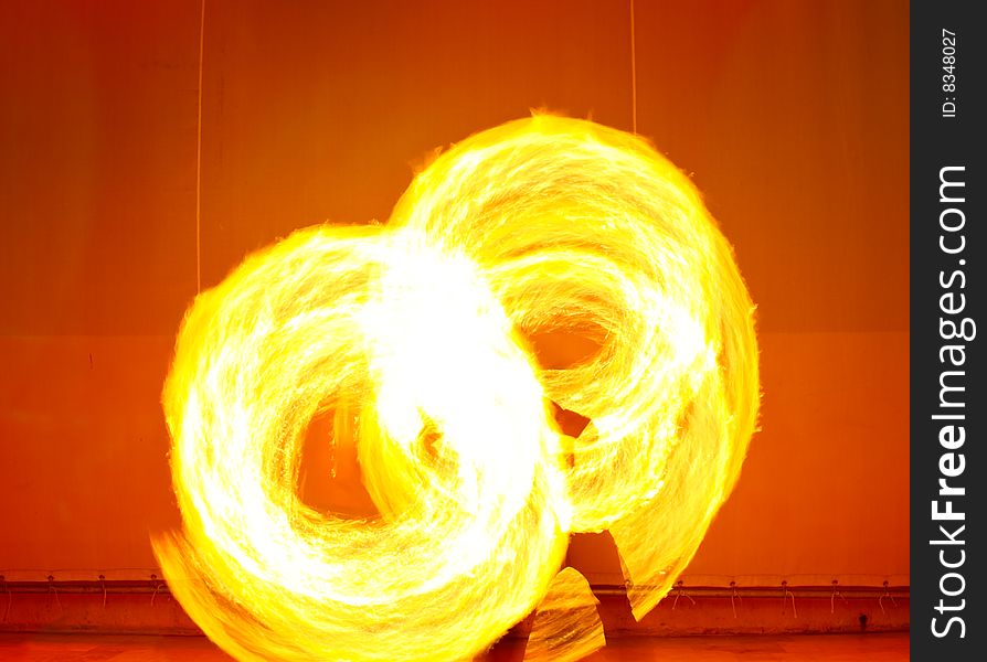 A fire show performed on stage in a beach resort