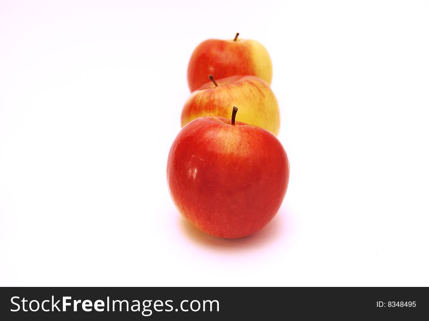 Three red apples on a white background. Three red apples on a white background