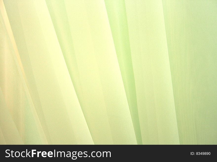 Picture of green luxurious curtains.