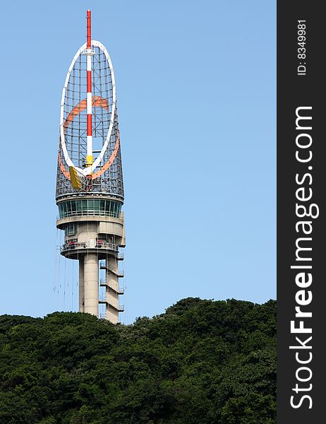 A Photo of a control tower directing traffic in a harbour. A Photo of a control tower directing traffic in a harbour