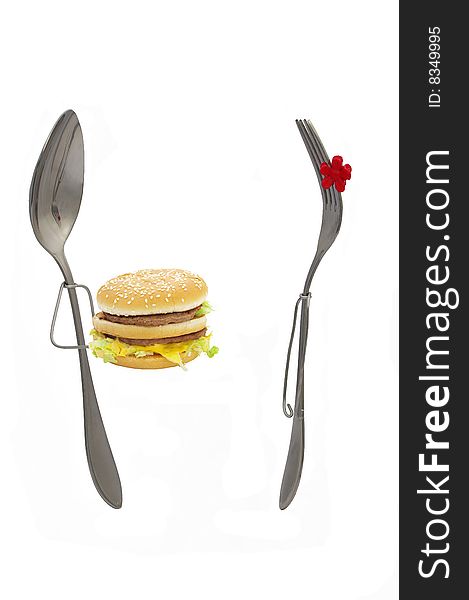 Spoon and fork on a white background. Burger. Spoon and fork on a white background. Burger.