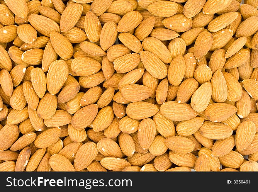 Crude almonds laying as a back background