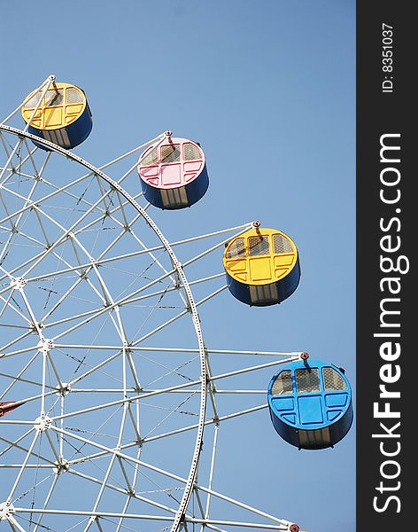 The colorful Ferris wheel with bright colors.