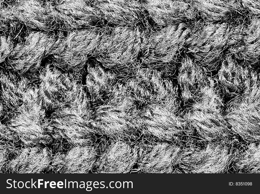 A close-up of the texture of grey woolen fabric. A close-up of the texture of grey woolen fabric