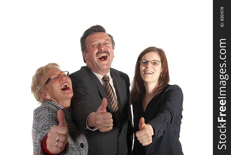 Senior business team with a young female worker giving thumbs up sign! They are all laughing hard!. Senior business team with a young female worker giving thumbs up sign! They are all laughing hard!