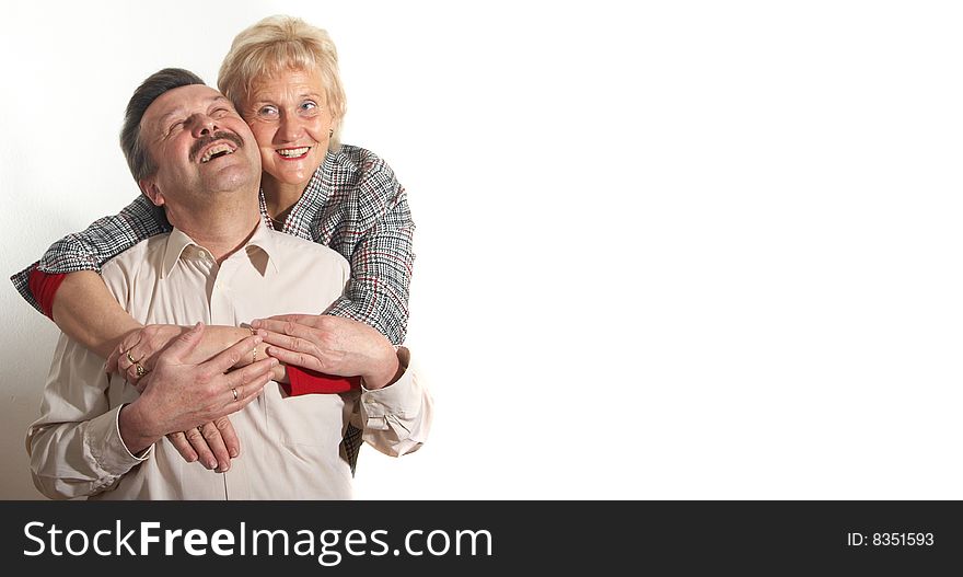 Happy old couple at home with copyspace. Isolated over pure white. Happy old couple at home with copyspace. Isolated over pure white.
