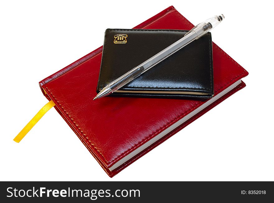Two notebooks (organizers) and jell pen on isolated background. Two notebooks (organizers) and jell pen on isolated background.