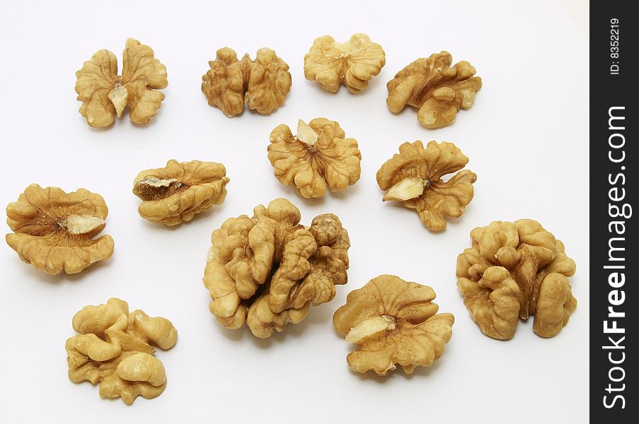 Kernels of walnuts on white background.