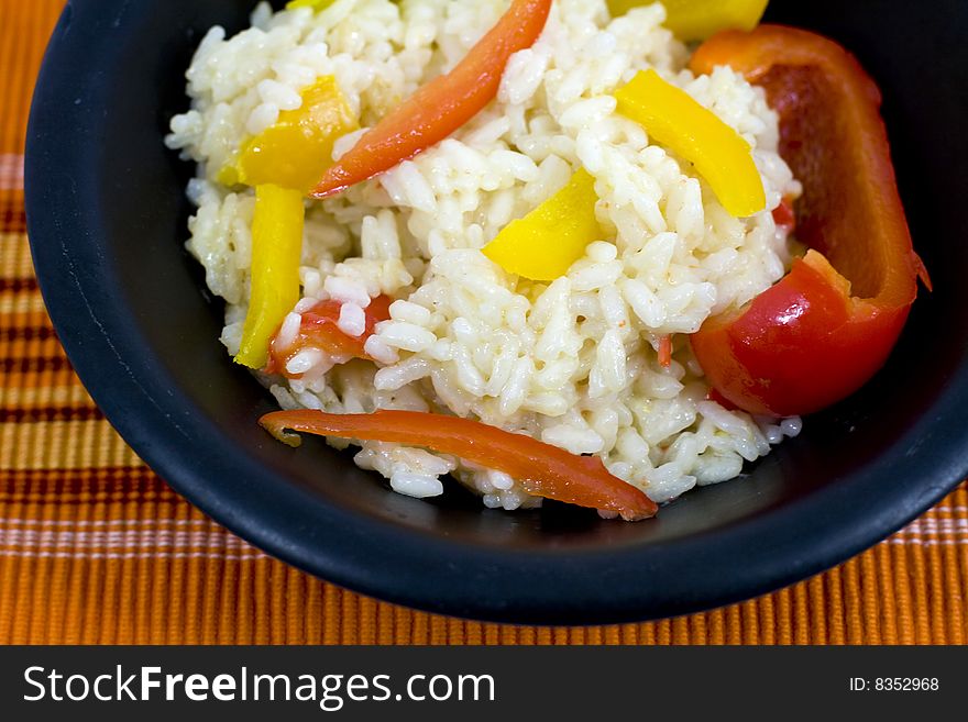 Italian rice with yellow and red peppers. Italian rice with yellow and red peppers