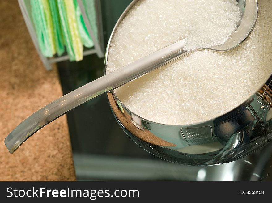Food series: macro picture of sugar basin and spoon