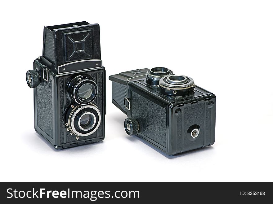 Two old photo cameras on white background