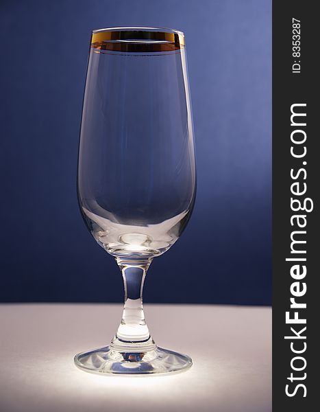 Champagne glass on dark blue background