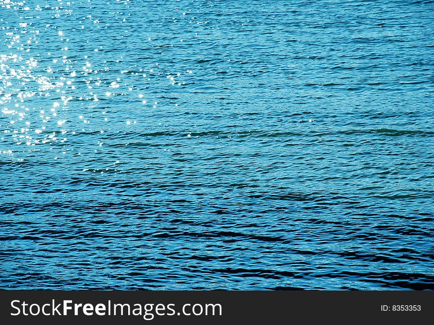 Blue sunny water natural surface. Blue sunny water natural surface