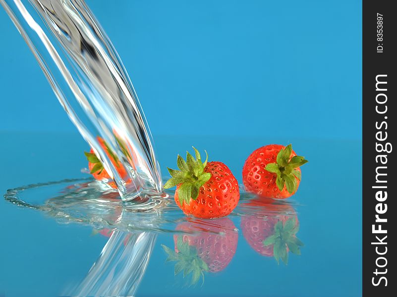 Blue background of water and Strawberry
