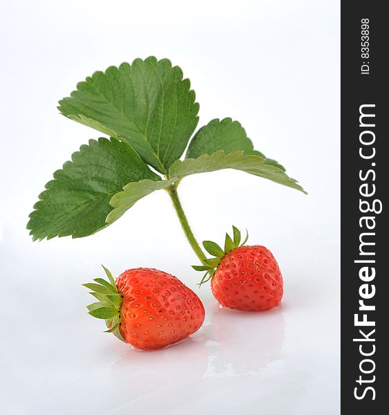Strawberries With leaf on white background. Strawberries With leaf on white background.