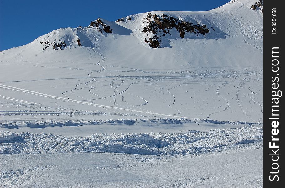 Ski trails on snowed mountain peak in Stubai resort, Austria