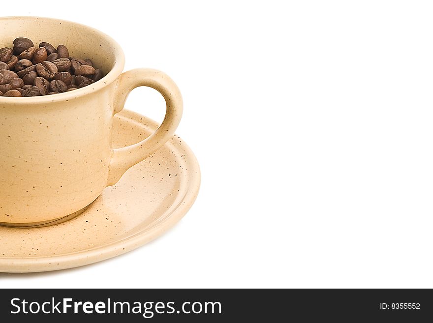 Coffee beans and cup isolated on white background