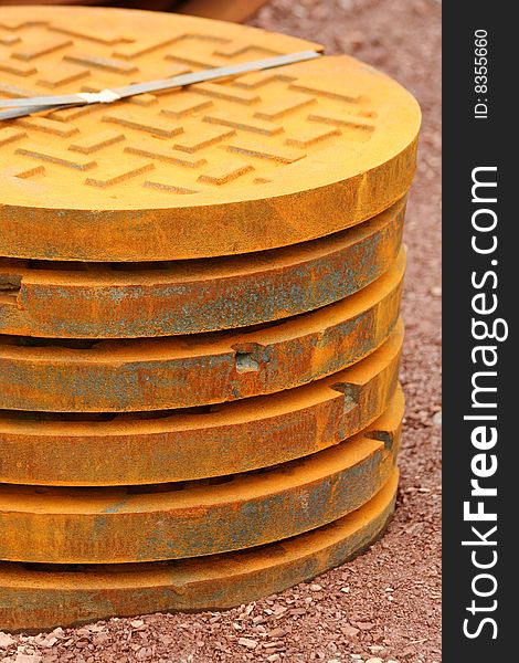A stack of manhole covers