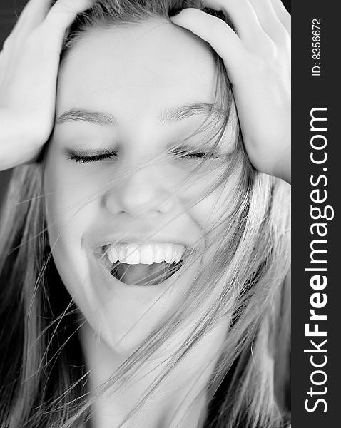 Bright bw closeup portrait of happy girl face holding your head. Bright bw closeup portrait of happy girl face holding your head