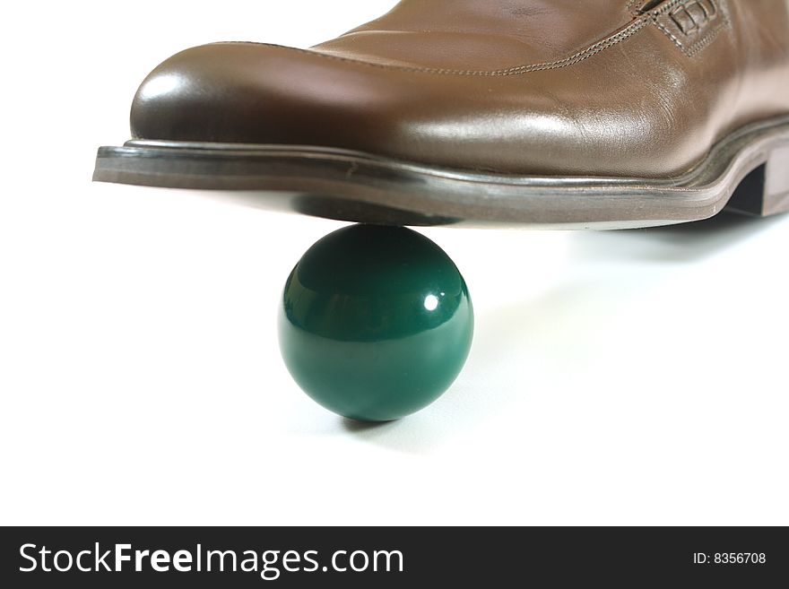 Shoes on a white background and green ball