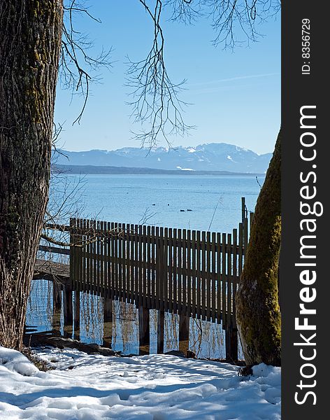 Lake Starnberger See in Bavaria, Germany. The mountain range in the background are the European Alps. The picture was taken on a beautiful winter day.