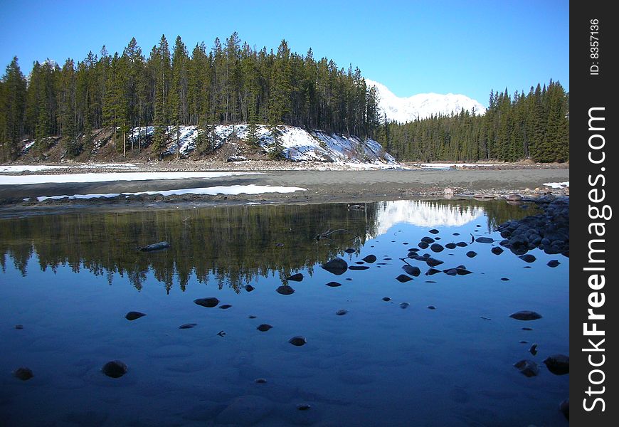 Reflection off a lake in Jasper National Park in Alberta. Reflection off a lake in Jasper National Park in Alberta.